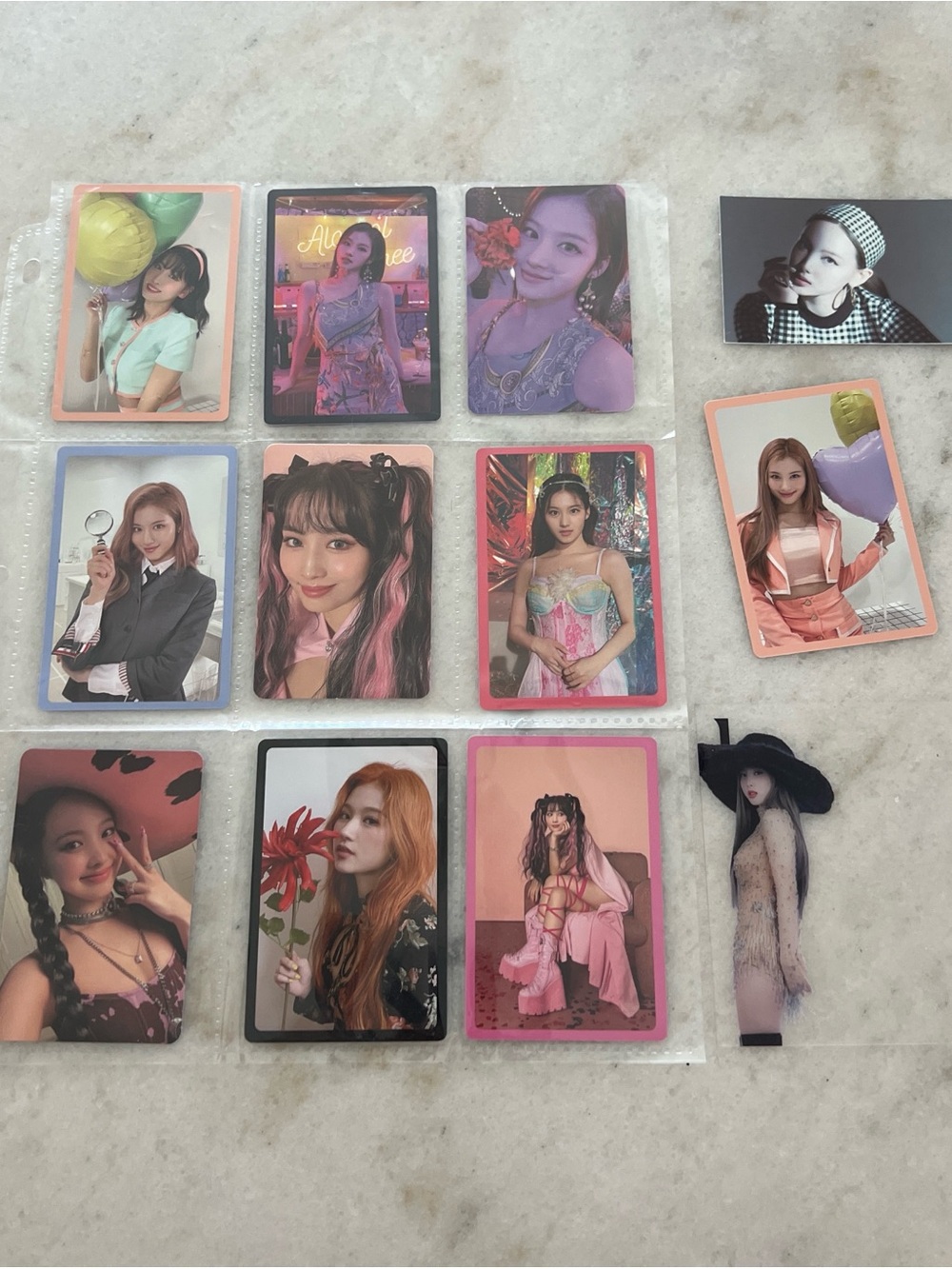 TWICE K-pop 12 photocards featuring various members from different albums.